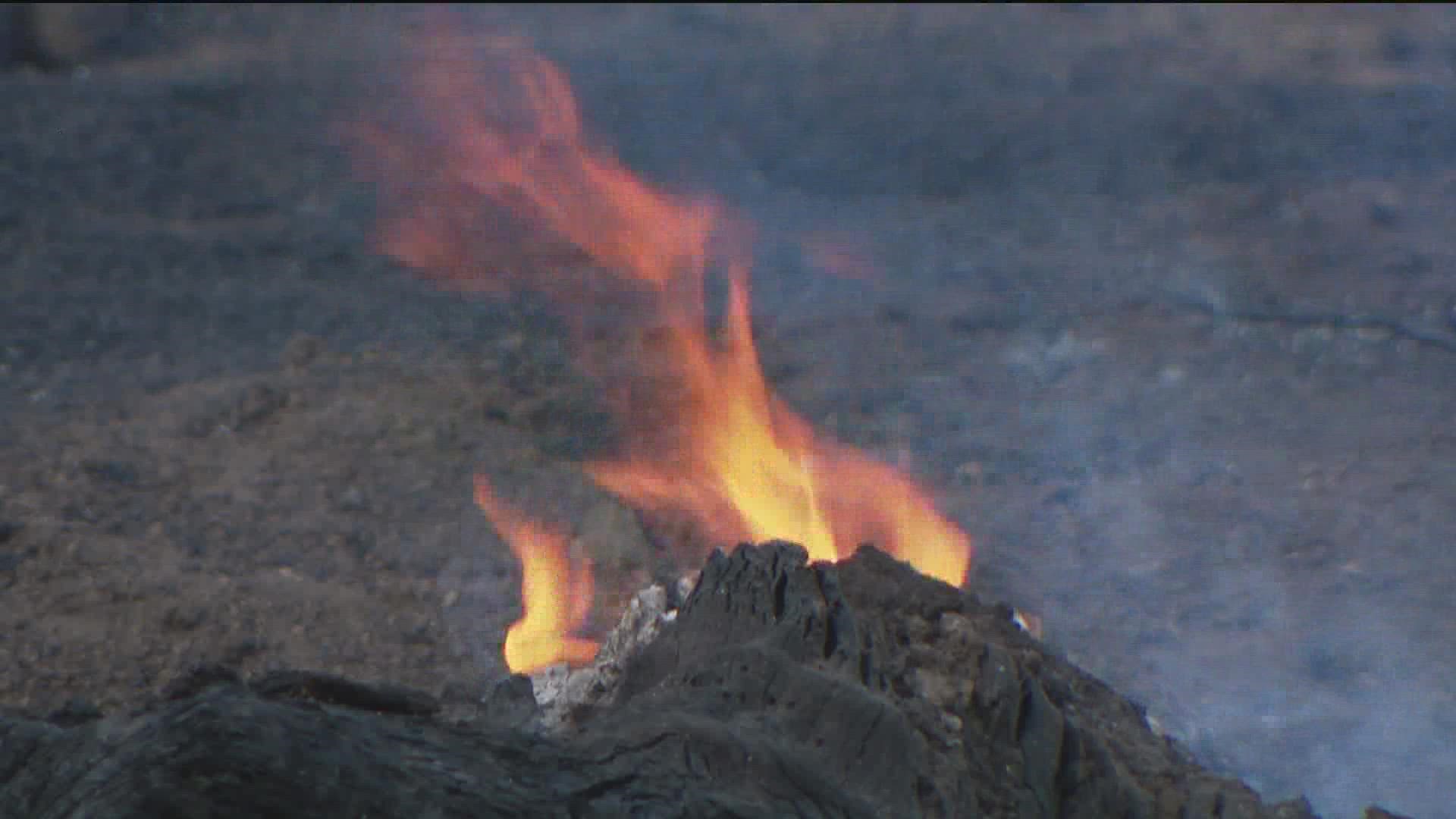 Crews stopped the spread of the Caesar Fire at 50 acres. Firefighters continued monitoring hot spots Monday evening.